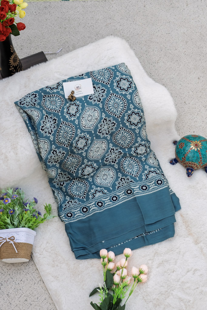 Teal Blue Modal Silk Saree with Dokam Tissue Lakdi Patta Border